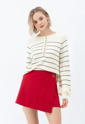 Pull rayé en maille boutonnée en crème
